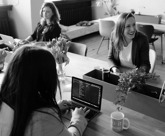 office workers at shared table